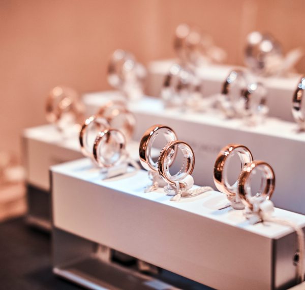 Set of different gold rings on the showcase of a luxury jewelry store, Close-up photo